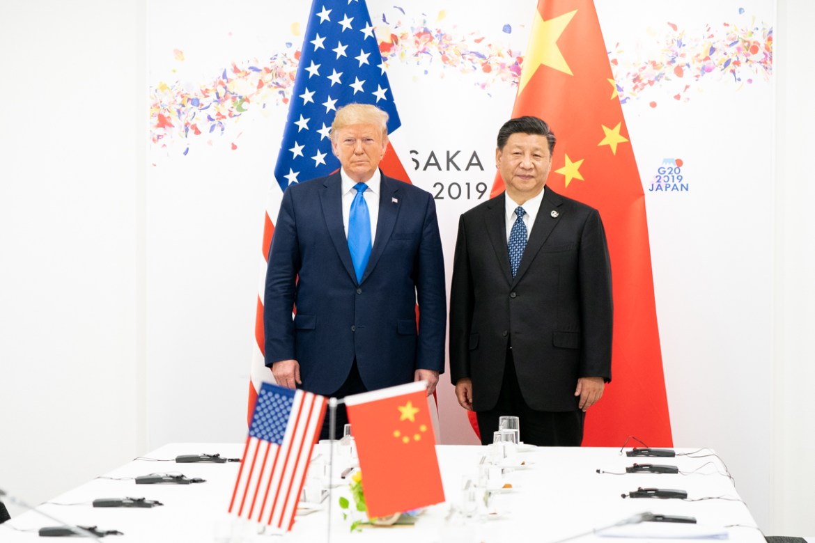 US President Donald Trump and Chinese President Xi Jinping posing for the cameras before the start of their 2019 G20 Japan Summit